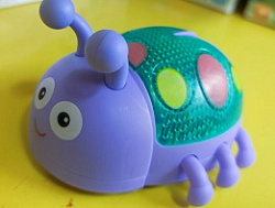 игрушка заводная светящаяся